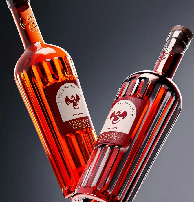 Two red glass bottles with ribbed design against a dark background
